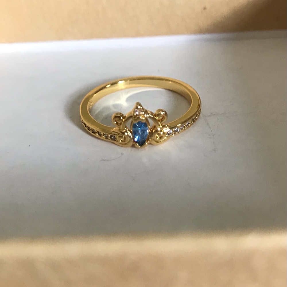 Gold Ring with Blue Marquise Stone and Accent Diamonds